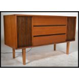 A 1970's mid century teak wood radiogram stereogram having hinged top opening to reveal record deck,