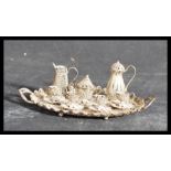 A 19th century Victorian silver filigree miniature dolls house tea service on twin handled gallery