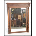 An early 20th Century mahogany framed over mantel