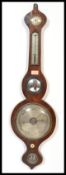 A 19th century mahogany wall mounted banjo barometer with central convex mirror over silvered dial