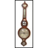 A 19th century mahogany wall mounted banjo barometer with central convex mirror over silvered dial