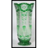 A large early 20th century Czech Bohemian cut glass vase of tall flared form having faceted