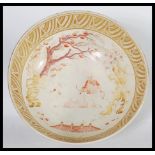 A very large 19th century English ceramic centerpiece fruit bowl painted in the Chinese taste with