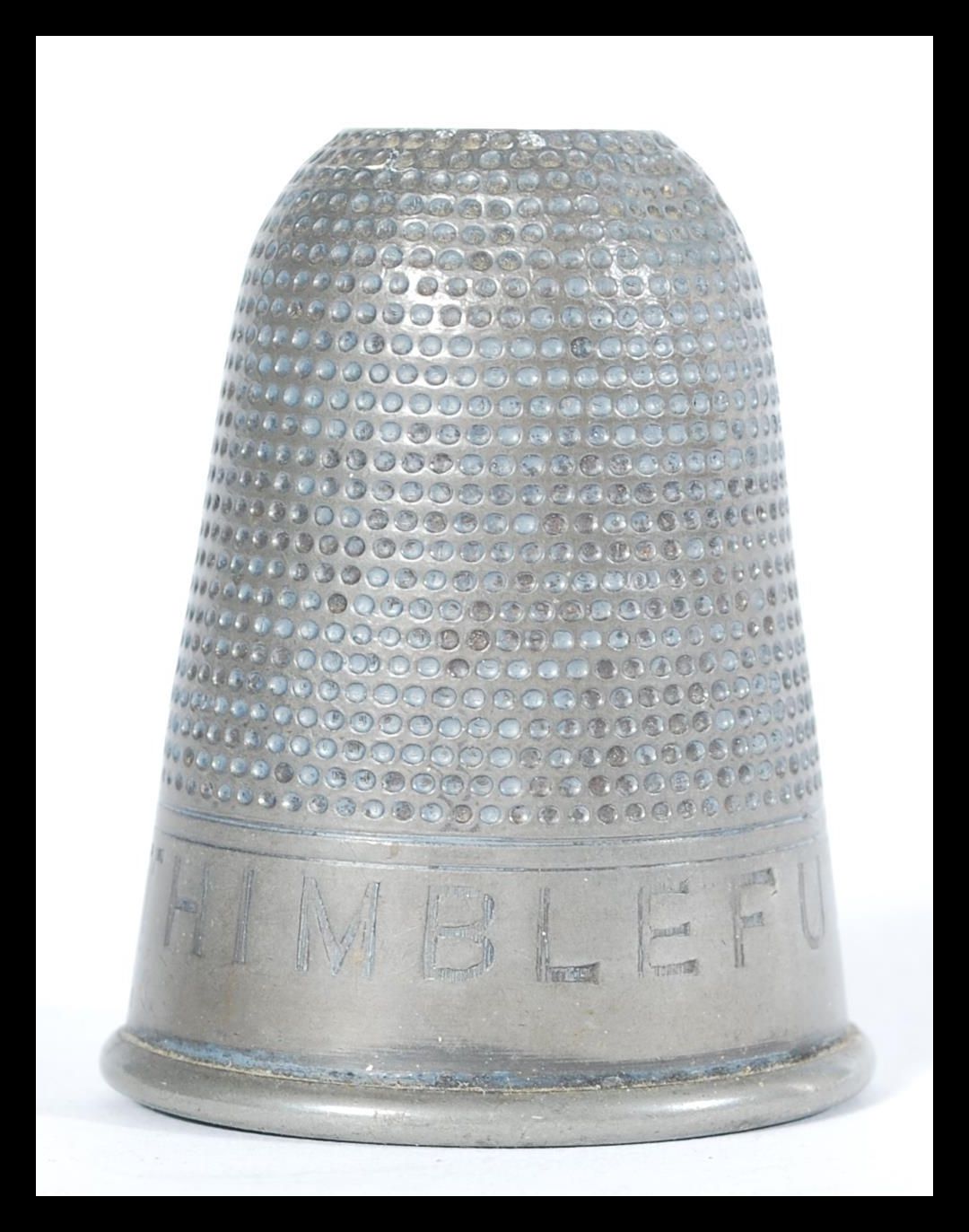 A vintage 20th Century novelty silver white metal spirit measure or tot, modelled as a thimble and