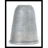 A vintage 20th Century novelty silver white metal spirit measure or tot, modelled as a thimble and