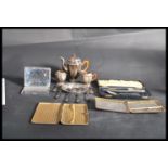A good group of vintage silver plate to include a miniature three piece tea service , a set of six
