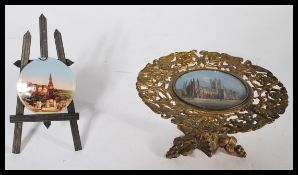 Two 19th century painting on glass souvenirs one in a gilt tazza depicting Canterbury Cathedral