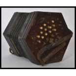 A 19th century Victorian rosewood squeeze box having a gilt tooled leather squeeze with bone buttons