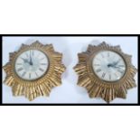 A pair of vintage mid 20th century retro Smiths sunburst wall clocks. The two tone dial having