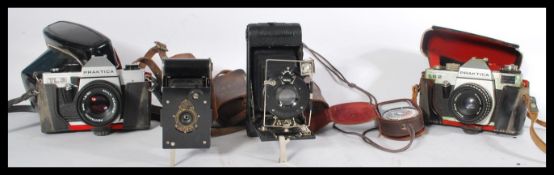 A collection of vintage cameras to include a cased Practika TL2, an Ensign bellows folding vest