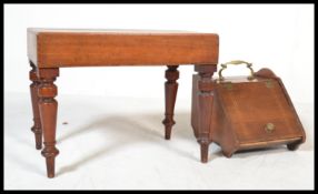 A 19th century Victorian mahogany bidet stool raised on turned legs with lift off cover and liner