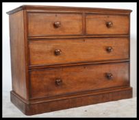 A Victorian mahogany oversized cottage 2 over 2 chest of drawers of good quality being raised on a