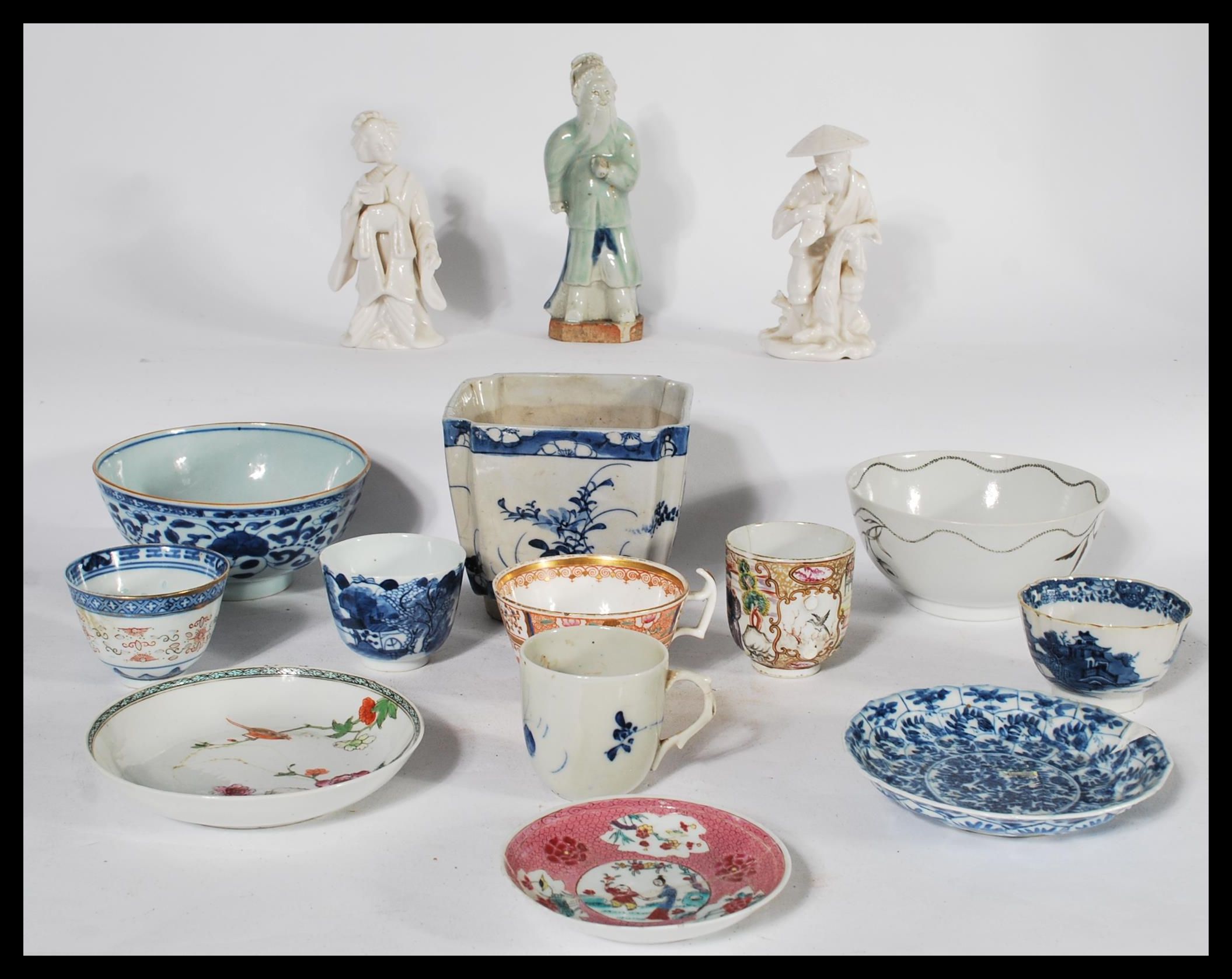 A collection of Chinese ceramics dating from the 19th century to include tea bowls , figures , bowls