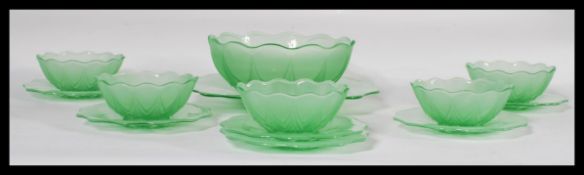 A six person uranium glass dessert set to include six bowls, large serving bowl, side plates and a