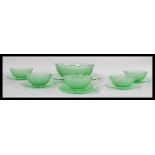 A six person uranium glass dessert set to include six bowls, large serving bowl, side plates and a