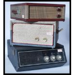 A collection of three vintage 20th Century four speed record players to include a Pilot, Ferguson,