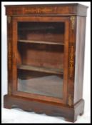 A Victorian mahogany and marquetry inlaid pier cabinet. Raised on a plinth base with glass door with
