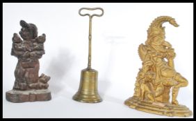 A group of three 19th Century doorstops to include a Victorian Mr Punch example and two others,