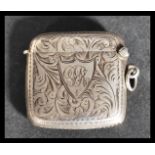An early 20th century silver hallmarked vesta case by Joseph Gloster Ltd having a chased foliate
