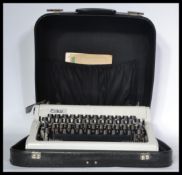A vintage mid century portable Erica typewriter, c