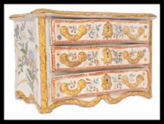 A 19th century Faience hand painted serpentine fronted commode chest of drawers jewellery box having