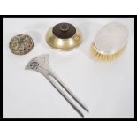 A mixed lot to include a silver hallmarked brush , filigree trinket pot , white metal hair piece ,