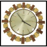 A mid century retro Metamec ' Aztec ' wall clock having silvered dial with baton numerals all within