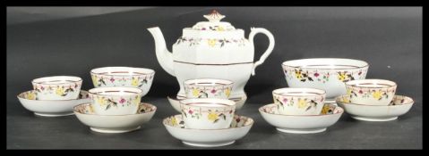 An early 19th Century tea service to include tea bowls and saucers, decorated with fauna on pink