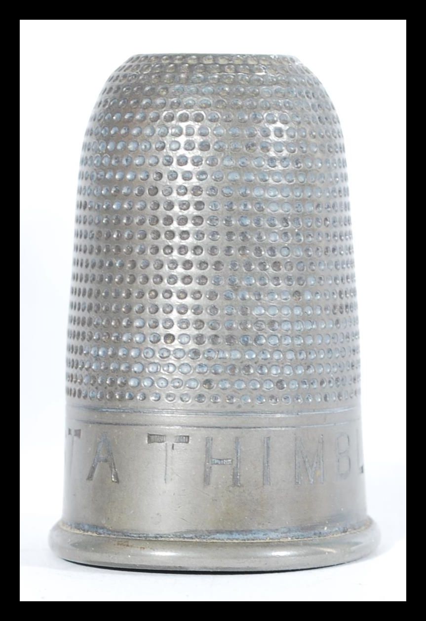 A vintage 20th Century novelty silver white metal spirit measure or tot, modelled as a thimble and - Image 4 of 6