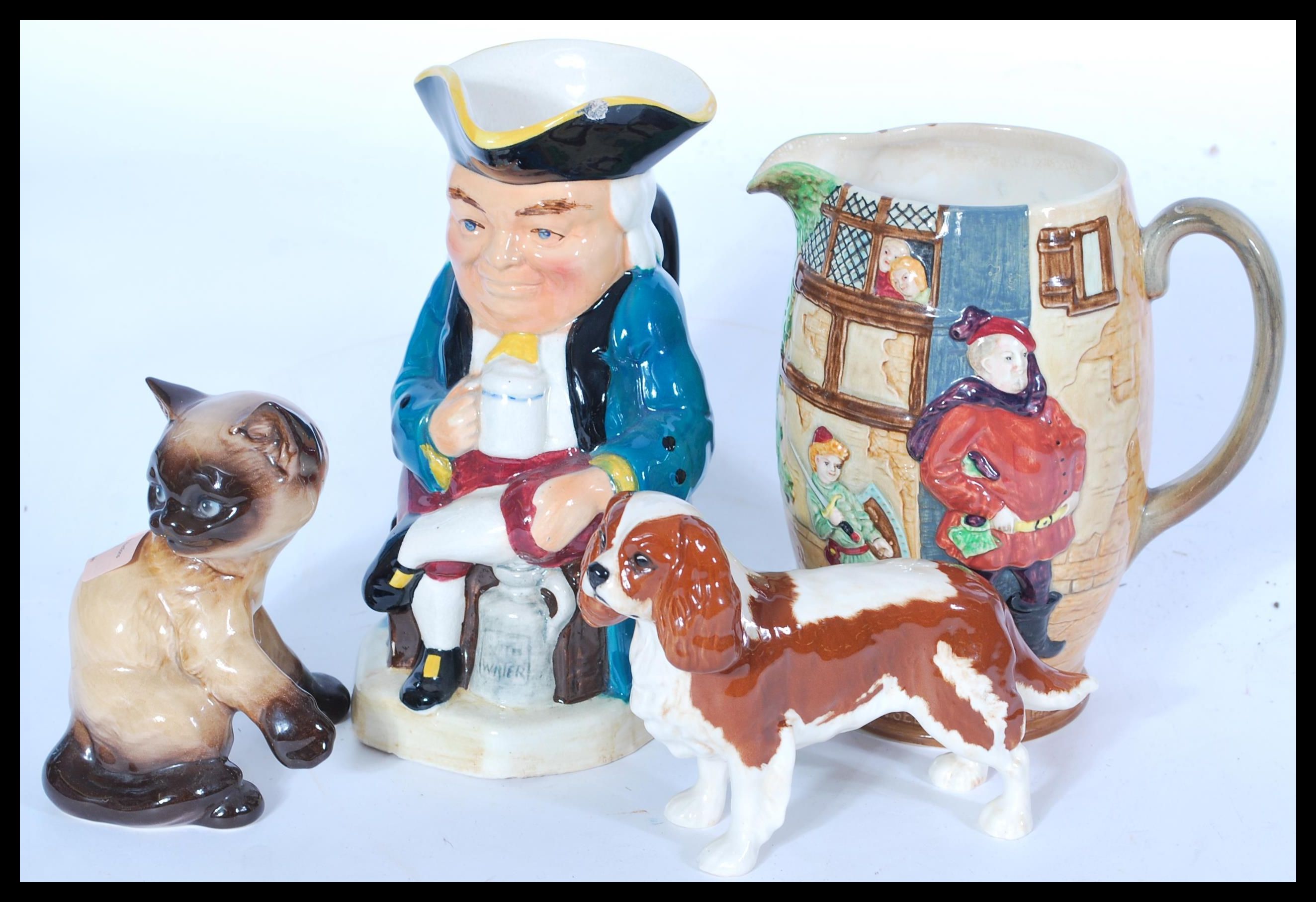 A collection of ceramics to include a Beswick Spaniel, Goebels dog, Toby Jug etc please refer to