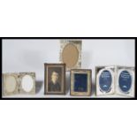 A collection of silver plated easel picture frames together with a silver sterling hallmarked