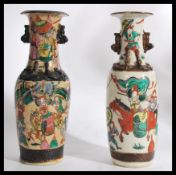 A pair of believed 19th century Chinese vases having crackle glaze with painted decoration of