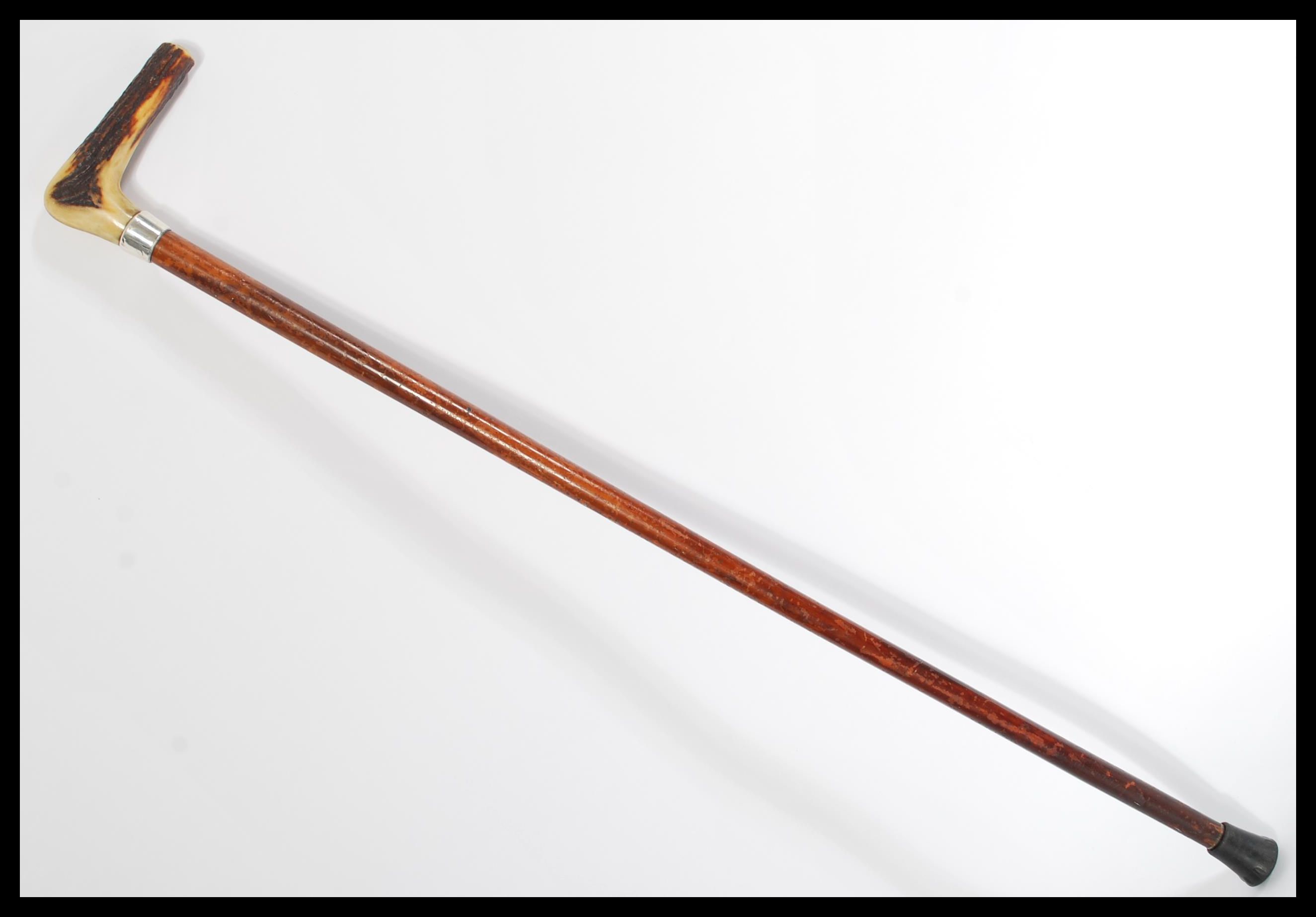 A 19th century Victorian silver hallmarked walking stick cane. The tapering Malacca shaft having a
