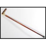 A 19th century Victorian silver hallmarked walking stick cane. The tapering Malacca shaft having a
