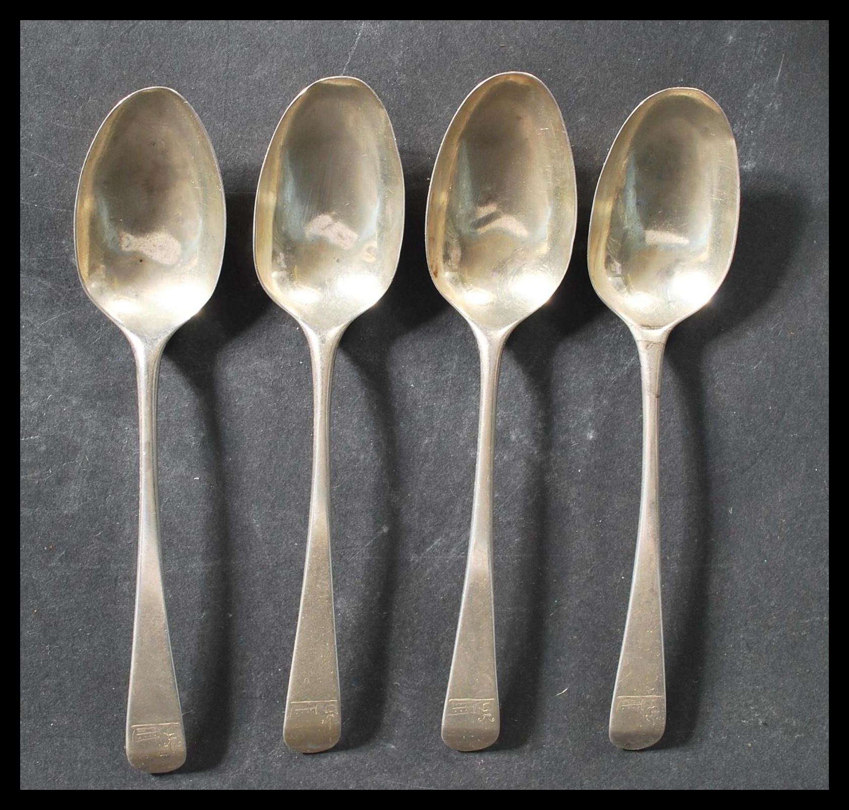 A set of four 18th century Georgian silver table spoons by William Sumner & Richard Crossley. All in