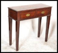 A 20th Century hardwood inlaid decorated campaign style console table, the two short drawers with