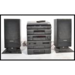 A retro 20th Century Pioneer musical stacking system, consisting of amplifier, tape decks, radio and