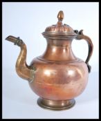 A middle eastern metal-ware brass and copper coffee pot, probably Turkish, tapering circular form,
