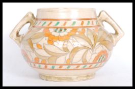 A Rhead for Crown Ducal baluster vase bowl having twin angular handles. Hand painted Art Deco floral