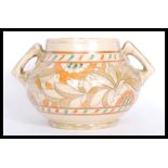 A Rhead for Crown Ducal baluster vase bowl having twin angular handles. Hand painted Art Deco floral