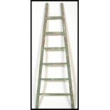 A vintage retro 20th century industrial hop / apple picking ladder of tapering form with painted