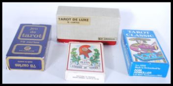 Three packs of 20th Century Tarot cards to include vintage packs, French packs, please refer to