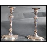 A pair of 20th century vintage silver plated candlesticks