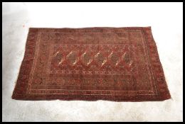 A good early 20th Century Kelim floor rug / carpet on red ground, large central geometric panel with