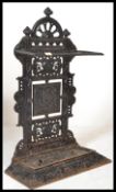 A Victorian 19th century aesthetic movement cast iron two section stick stand in the manner of