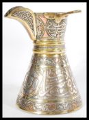 A 19th century Islamic Dallah coffee / chocolate copper pt having extensive calligraphy with