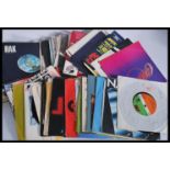 A collection of vinyl 7" singles featuring several artists to include Status Quo, Roxy Music, ELO,