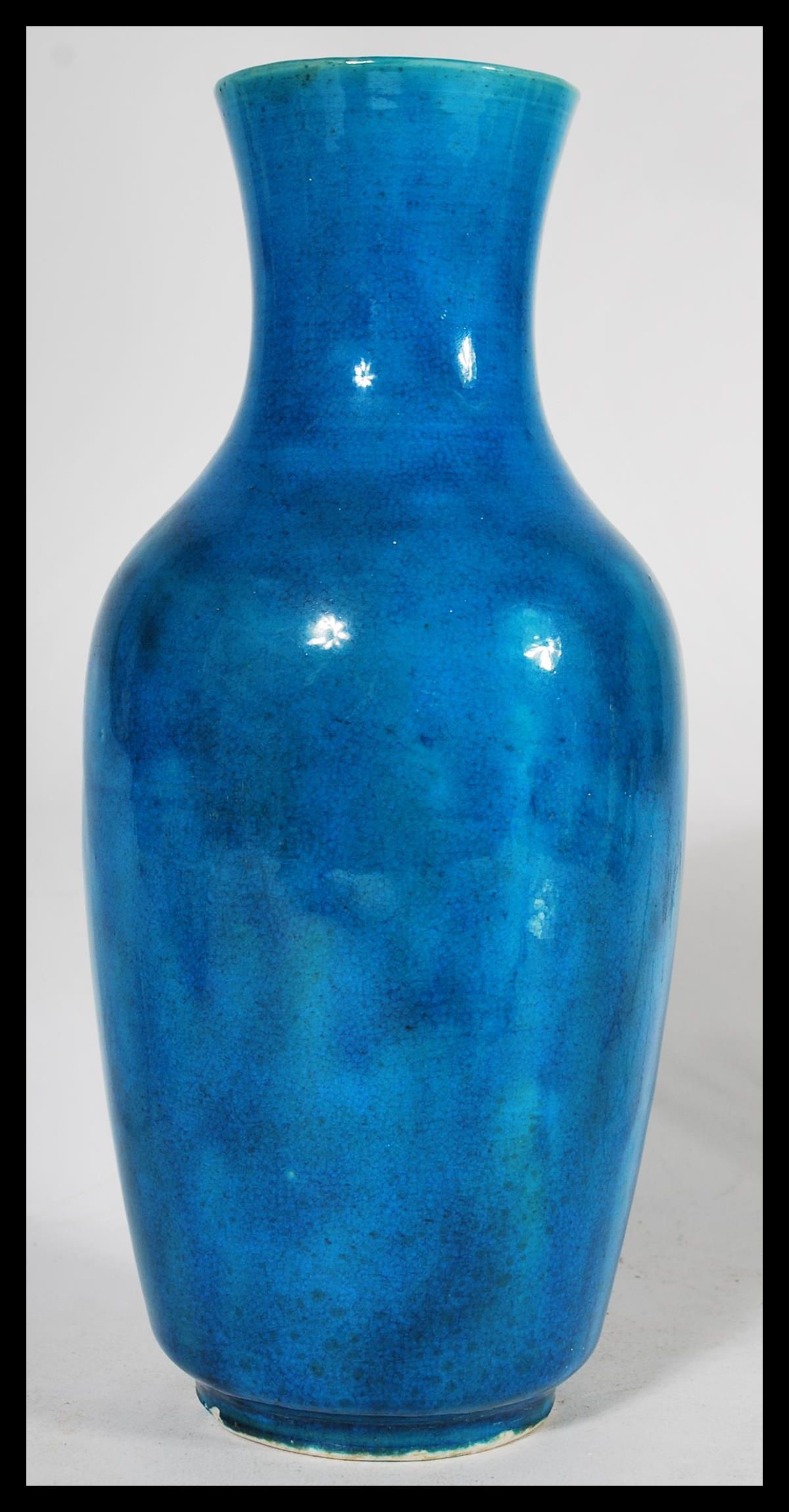 A 19th century Chinese monochrome bottle vase, glazed in merging tones of vibrant blue, elongated - Image 4 of 6