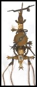 A seven day skeleton lantern style wall clock with single weight driven movement and pendulum,
