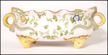 A 19th century continental Faience twin handled fr